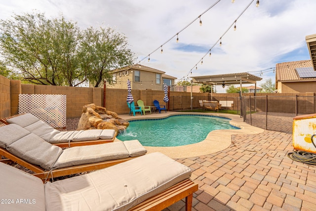 view of pool with a pergola, pool water feature, and a patio