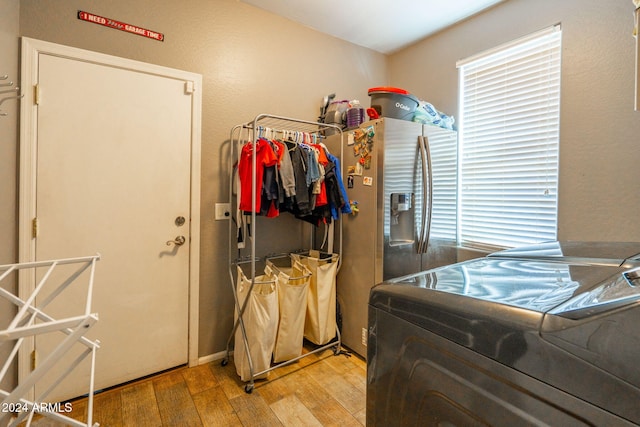 washroom featuring light hardwood / wood-style floors and independent washer and dryer