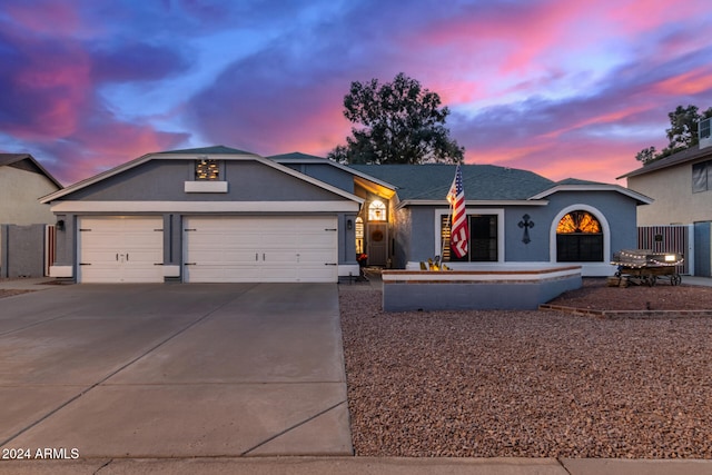 single story home with a garage