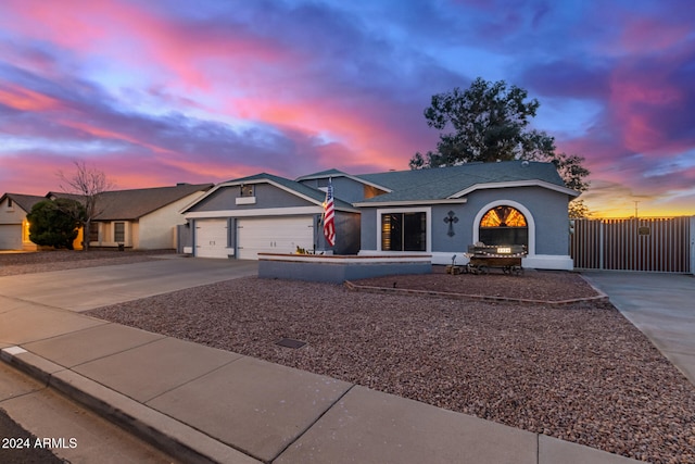 single story home featuring a garage