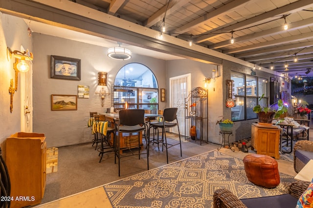 dining room with beamed ceiling and wood ceiling