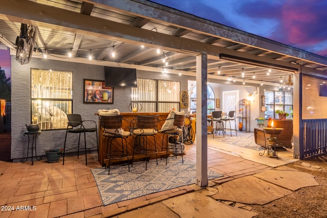 patio terrace at dusk with exterior bar