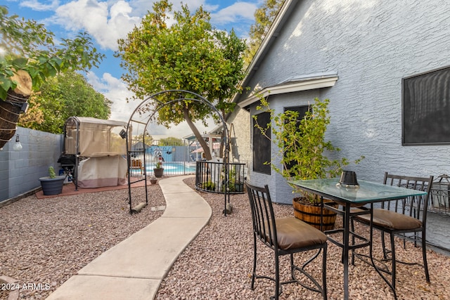 view of patio featuring a fenced in pool