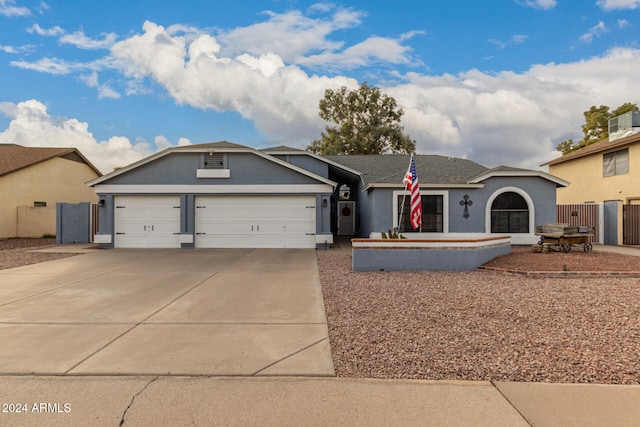 ranch-style house featuring a garage