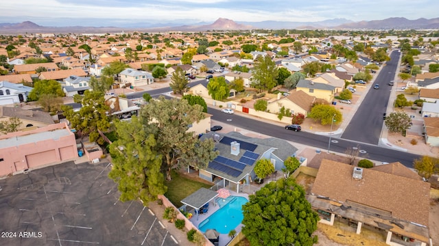 birds eye view of property featuring a mountain view