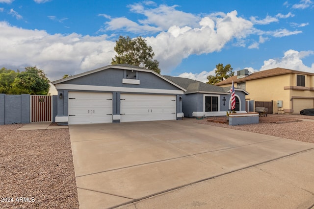 ranch-style house featuring a garage