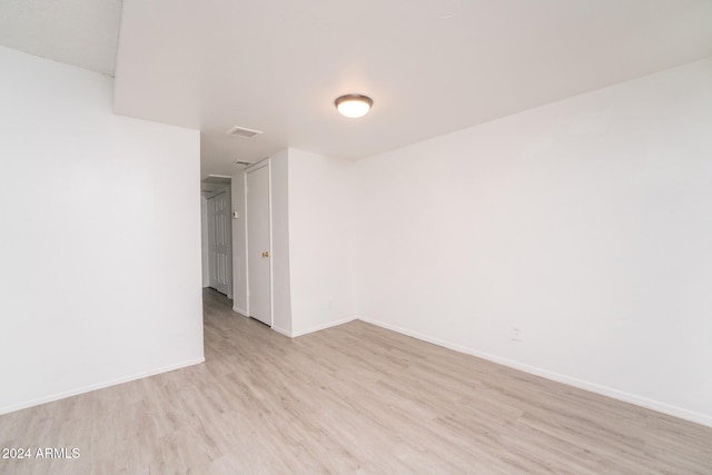 unfurnished room featuring light hardwood / wood-style flooring