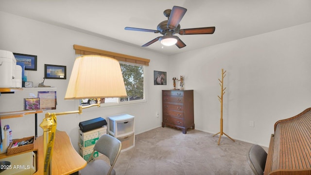 office area with baseboards and a ceiling fan