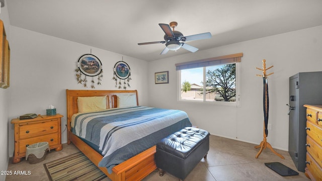 tiled bedroom with ceiling fan