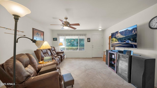 living room with light tile patterned floors and a ceiling fan