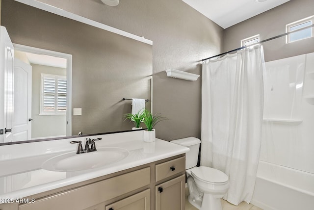 full bathroom featuring vanity, toilet, a textured wall, and shower / bath combo with shower curtain