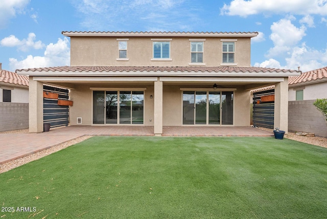 back of property with stucco siding, a fenced backyard, and a patio area