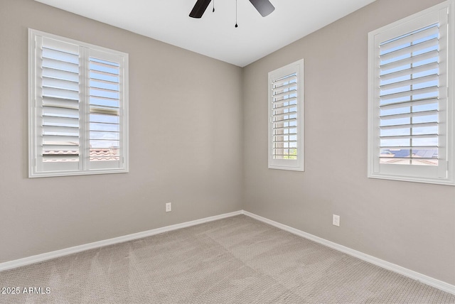 unfurnished room featuring ceiling fan, baseboards, and carpet floors