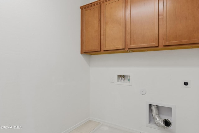 laundry area featuring hookup for a washing machine, baseboards, gas dryer hookup, hookup for an electric dryer, and cabinet space