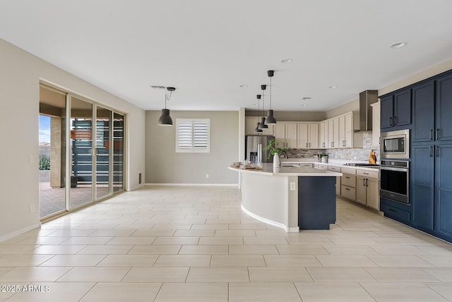 kitchen with stainless steel appliances, decorative backsplash, light countertops, decorative light fixtures, and wall chimney exhaust hood