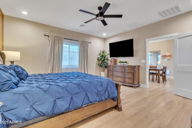 bedroom with light wood finished floors, baseboards, visible vents, and recessed lighting