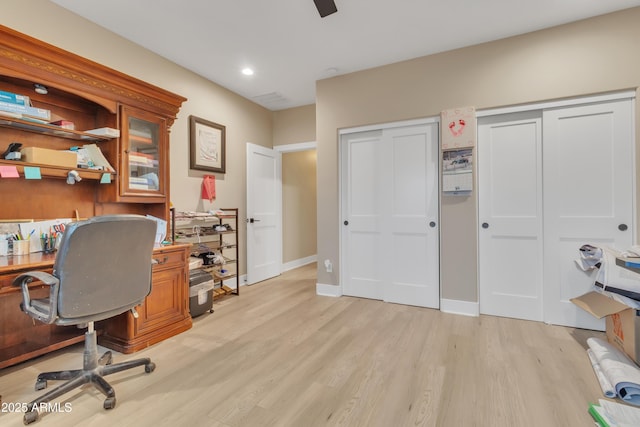 home office featuring recessed lighting, light wood-style flooring, and baseboards