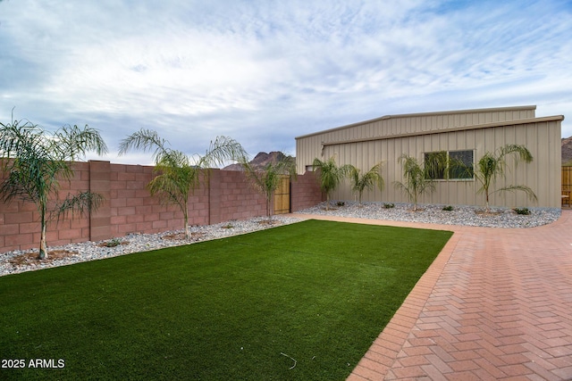 view of yard with a fenced backyard