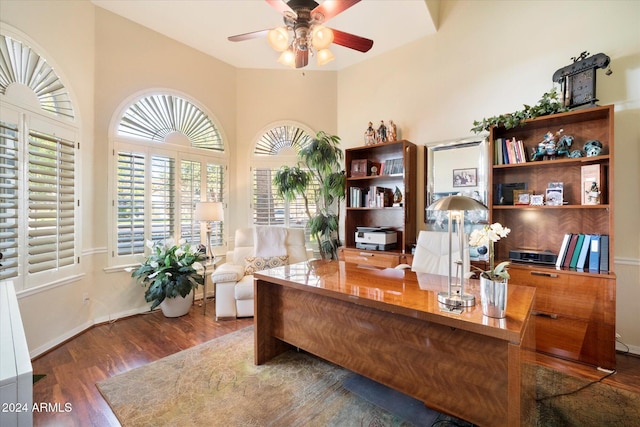 office space with ceiling fan and dark wood-type flooring