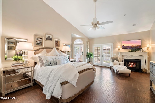 bedroom with dark parquet flooring, access to exterior, ceiling fan, french doors, and high vaulted ceiling