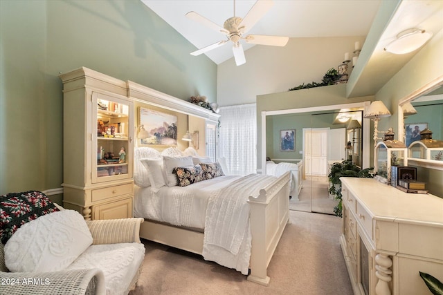 bedroom featuring light carpet, a closet, high vaulted ceiling, and ceiling fan