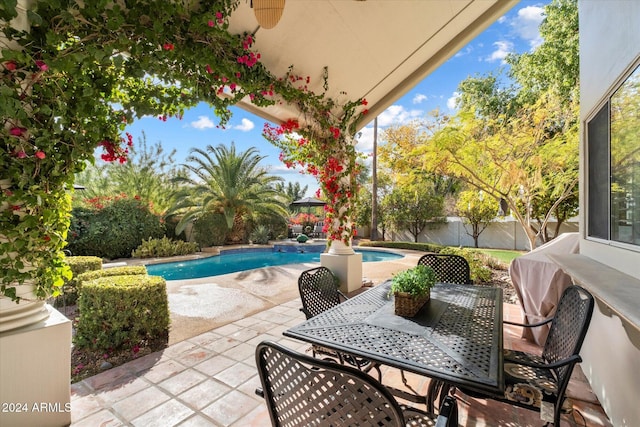 view of patio with a fenced in pool