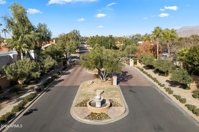 birds eye view of property with a mountain view