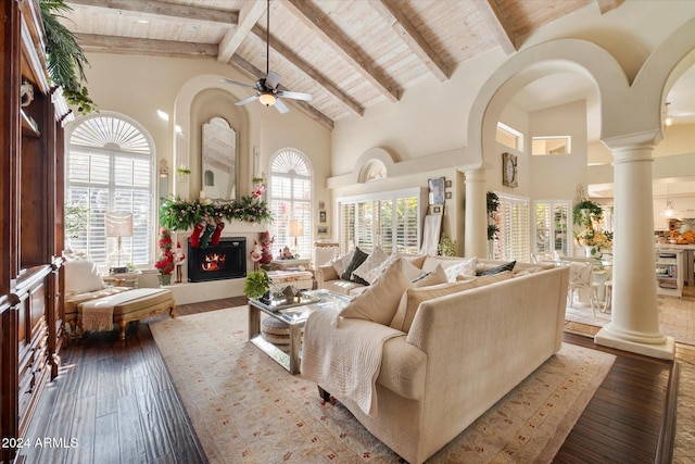 living room featuring high vaulted ceiling, ceiling fan, beamed ceiling, wood-type flooring, and wood ceiling