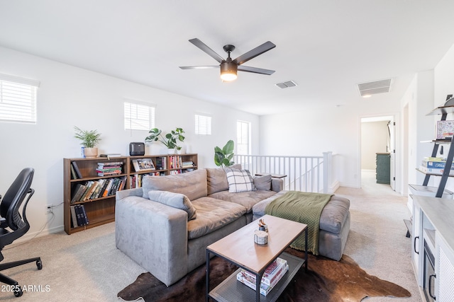 living room with light carpet and ceiling fan