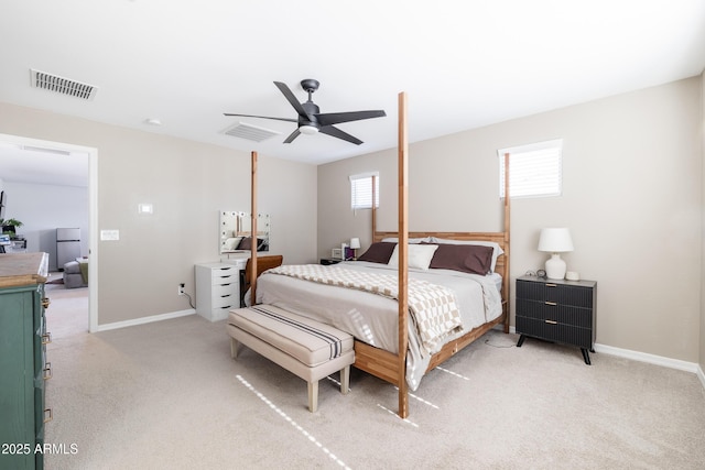 bedroom featuring ceiling fan and light colored carpet