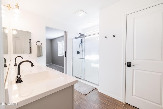 bathroom with vanity and a shower with shower door