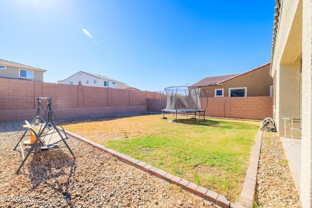 view of yard featuring a trampoline