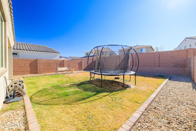 view of yard with a trampoline