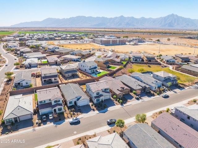 birds eye view of property with a mountain view