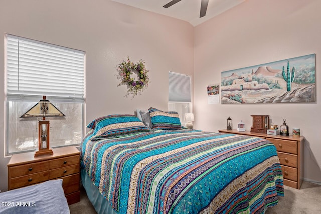 carpeted bedroom featuring ceiling fan