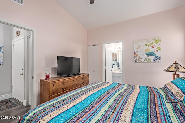 bedroom featuring ensuite bath, vaulted ceiling, ceiling fan, and hardwood / wood-style flooring