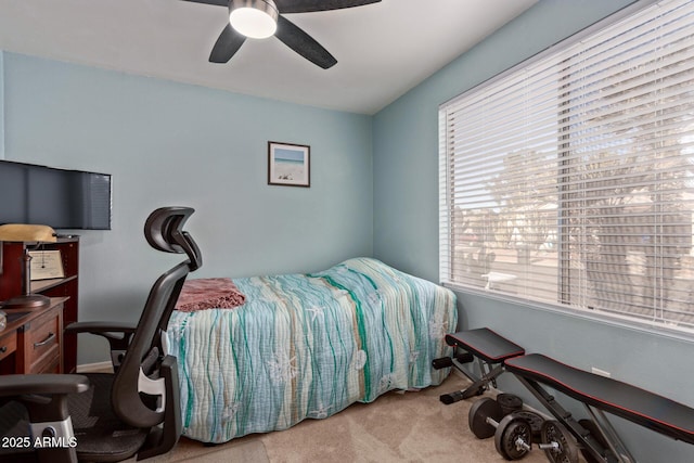 bedroom featuring light colored carpet and ceiling fan