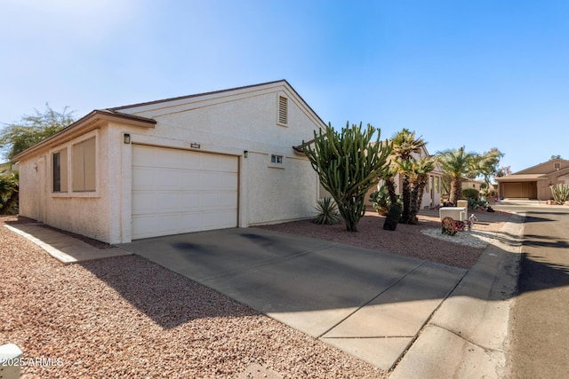 view of side of home with a garage