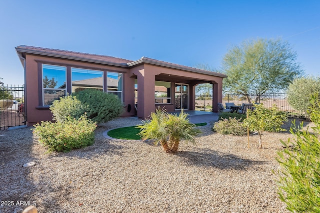 rear view of house with a patio area