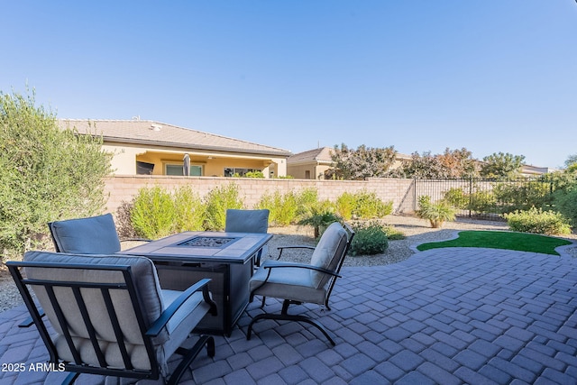 view of patio with a fire pit