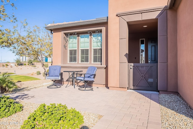 doorway to property featuring a patio area