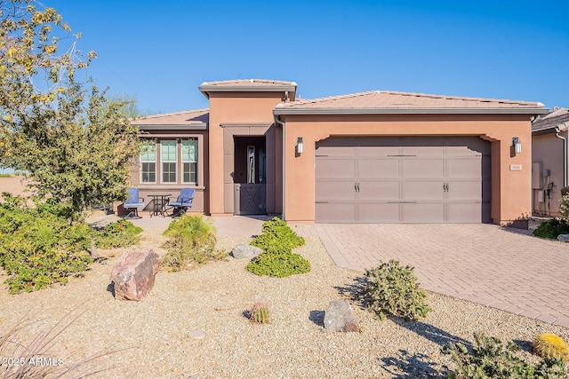 view of front of property with a garage