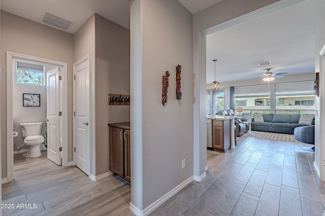 hallway featuring a healthy amount of sunlight