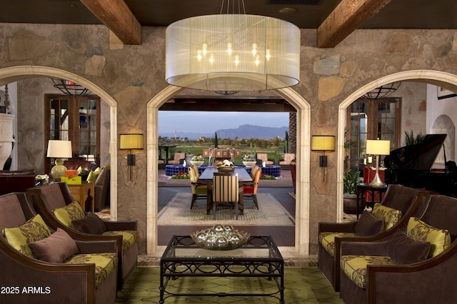 patio terrace at dusk featuring a mountain view and outdoor lounge area