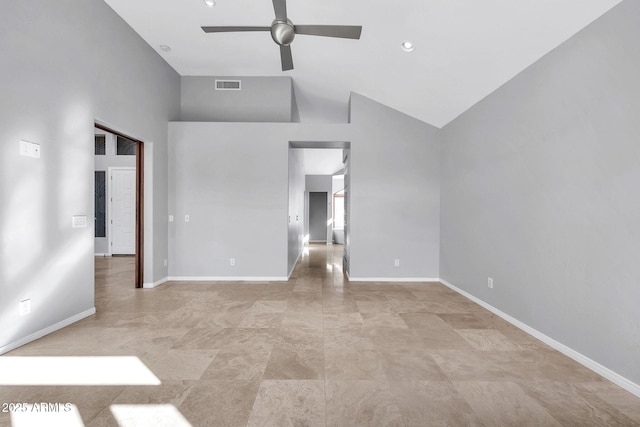 empty room with high vaulted ceiling and ceiling fan