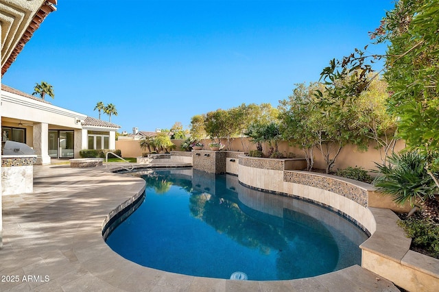 view of swimming pool featuring a patio area