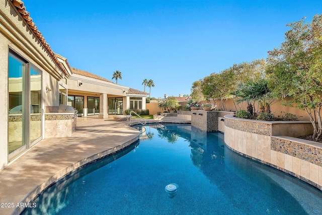 view of swimming pool with a patio area