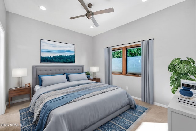 bedroom featuring light colored carpet and ceiling fan