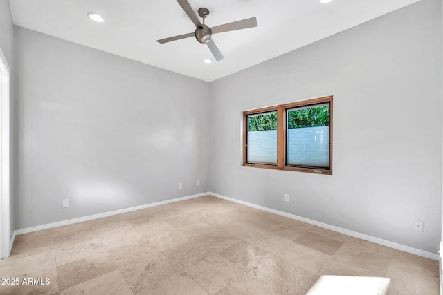 spare room with ceiling fan