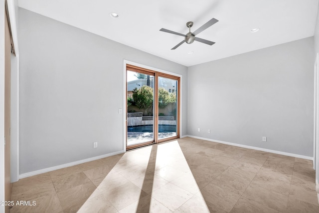 spare room with ceiling fan